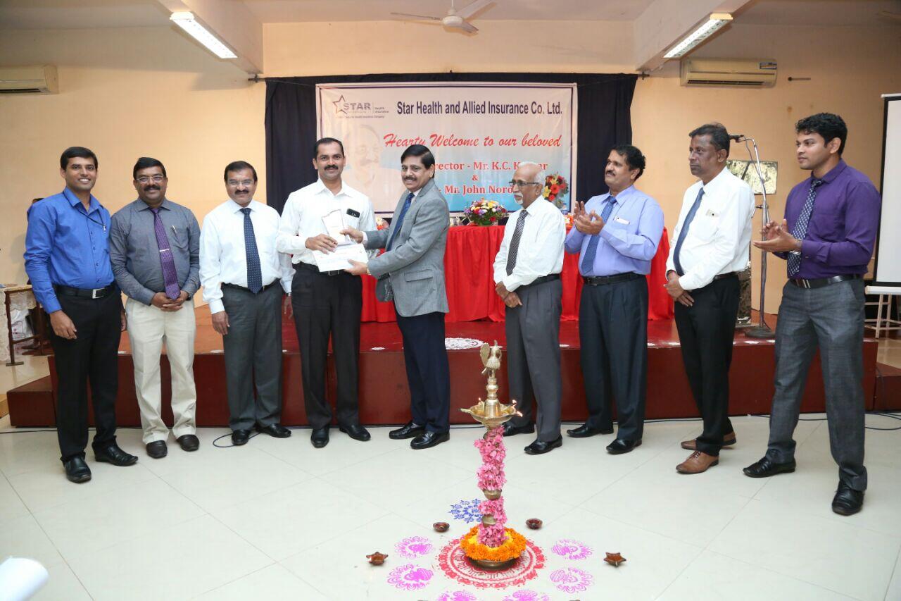 Honoring at Mangalore by Star Health and Allied Insurance Director Mr K C Kumar Sir